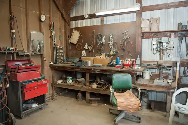 wide-shot-old-barn-s-workbench-with-different-types-tools-scaled wide-shot-old-barn-s-workbench-with-different-types-tools-scaled